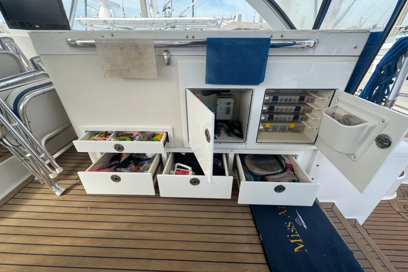 Slide: The Image of Storage drawers and compartments on a 2008 Luhrs 41 Open boat deck. - 37
