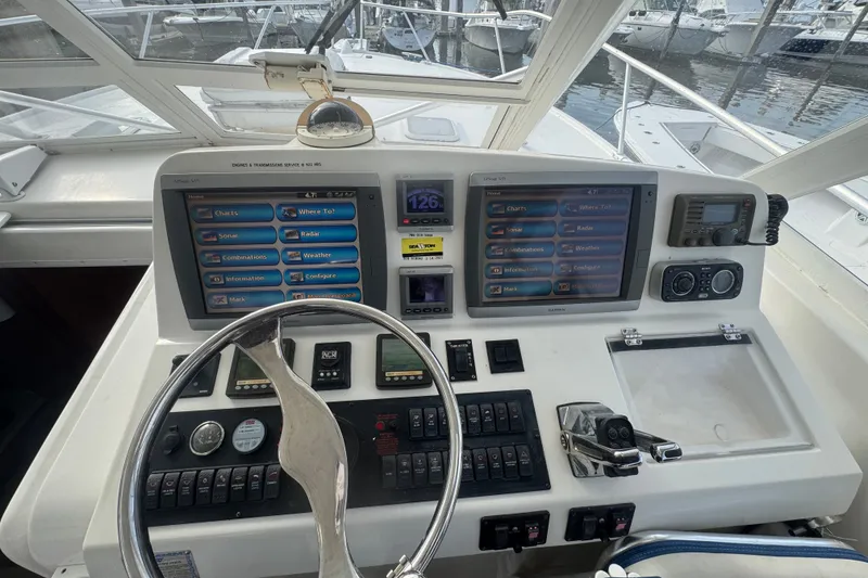 Slide: The Image of Helm of 2008 Luhrs 41 Open boat with navigation screens and controls. - 41
