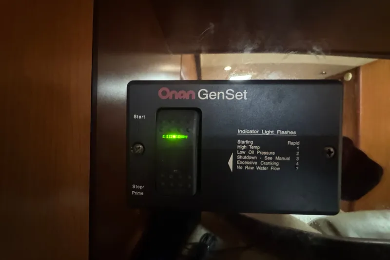 Slide: The Image of Onan GenSet control panel inside a 2008 Luhrs 41 Open boat. - 80