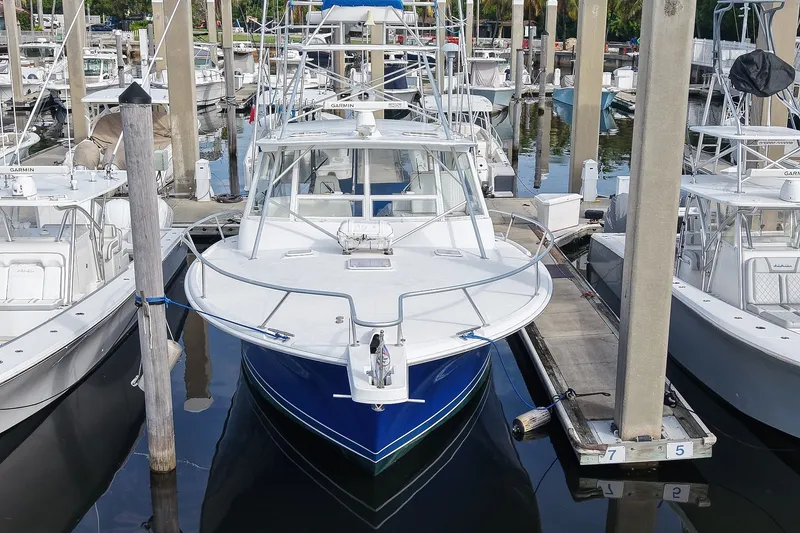 Slide: The Image of 2008 Luhrs 41 Open boat docked at marina, front view. - 104