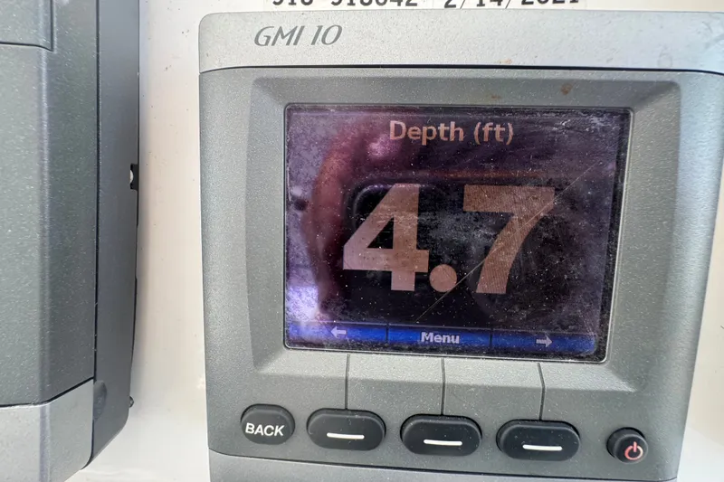 Slide: The Image of Depth gauge reading 4.7 feet on 2008 Luhrs 41 Open boat. - 47