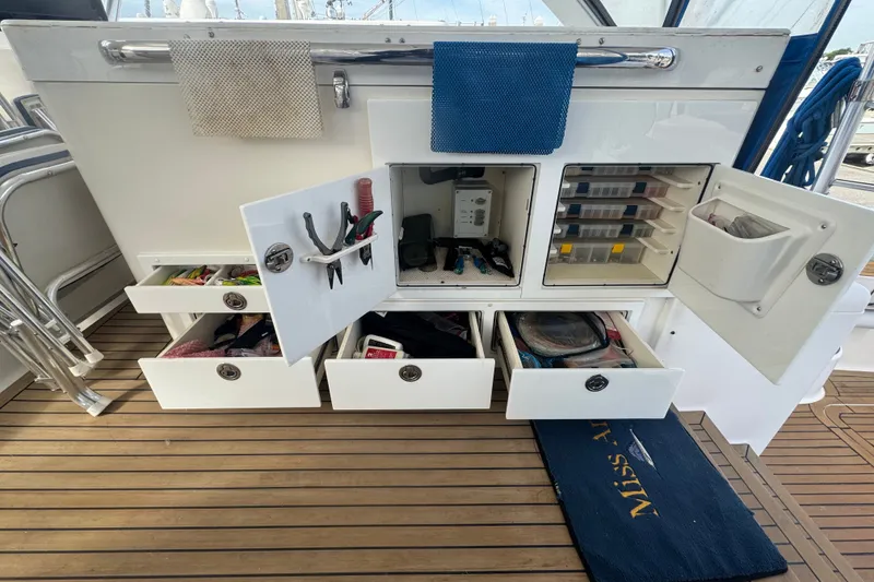 Slide: The Image of Storage compartments and drawers on a 2008 Luhrs 41 Open boat deck. - 38
