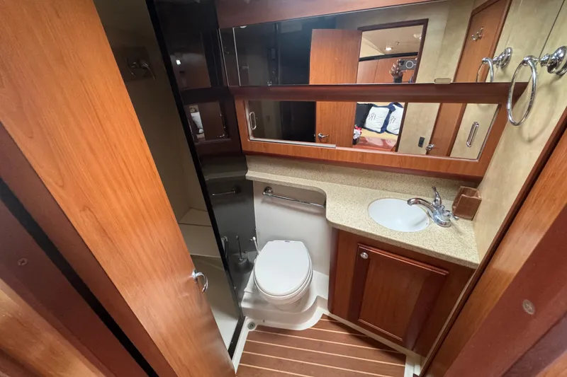 Slide: The Image of Luxurious 2008 Luhrs 41 Open yacht bathroom with wood accents and modern fixtures. - 74
