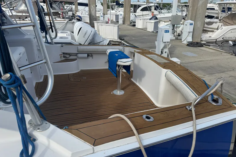 Slide: The Image of 2008 Luhrs 41 Open boat deck with wooden flooring at marina. - 13