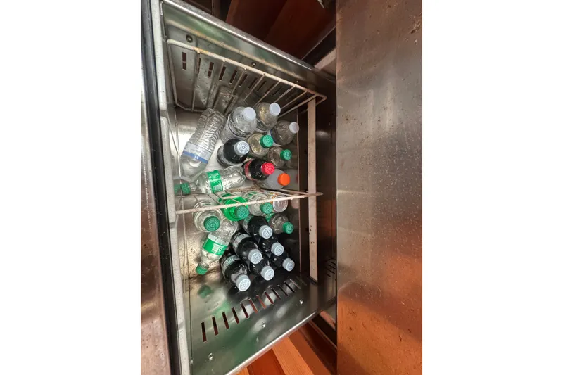 Slide: The Image of Beverage cooler on 2008 Luhrs 41 Open boat, filled with assorted bottled drinks. - 88