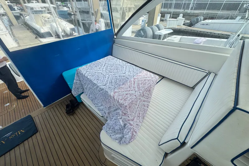 Slide: The Image of 2008 Luhrs 41 Open yacht interior with cushioned seating and patterned tablecloth. - 35
