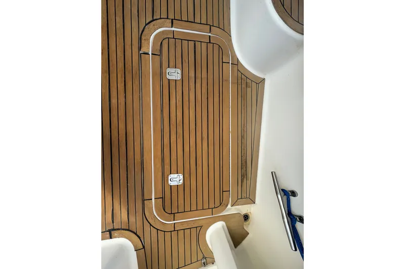 Slide: The Image of Teak deck of 2008 Luhrs 41 Open boat, featuring hatch and cleat. - 20