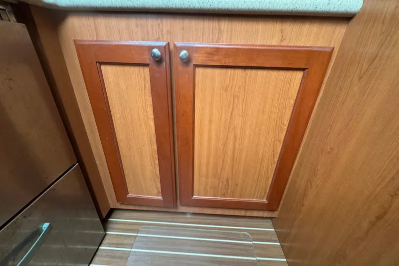 Slide: The Image of Wooden cabinet doors in 2008 Luhrs 41 Open boat interior. - 87