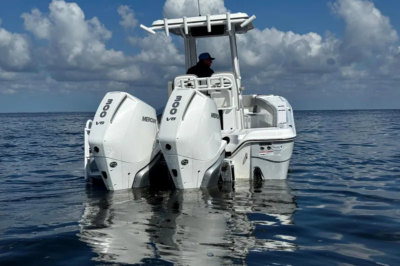 Slide: The Image of 2026 Blazer Bay Makaira 2800 boat with twin Mercury 300 V8 engines on open water. - 6