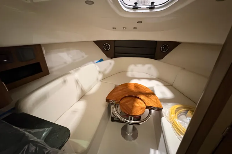 Slide: The Image of Luxurious interior of 2026 Boston Whaler 285 Conquest boat with elegant seating and table. - 17