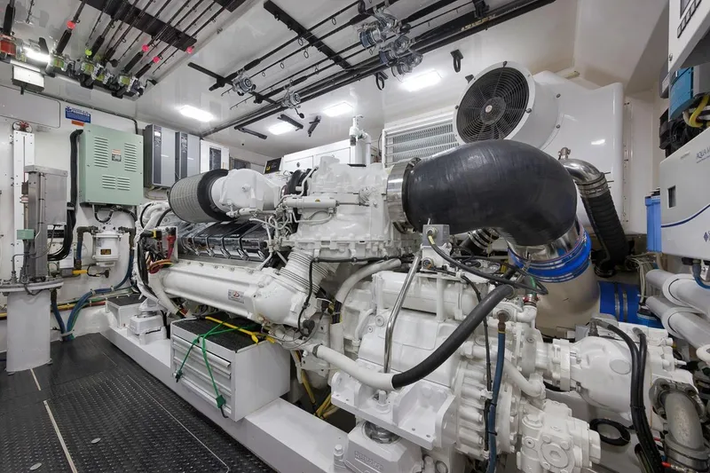 Slide: The Image of Engine room of 2018 Viking 92 Sky Bridge yacht, showcasing advanced machinery and equipment. - 127