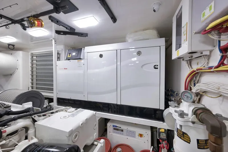 Slide: The Image of Engine room of 2018 Viking 92 Sky Bridge yacht with Cummins generator and wiring. - 129