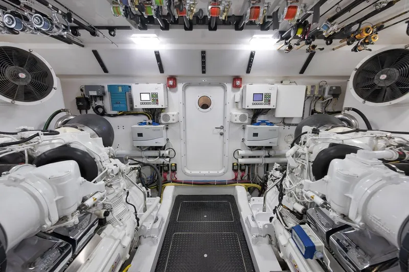 Slide: The Image of Engine room of 2018 Viking 92 Sky Bridge yacht, featuring advanced machinery and equipment. - 130