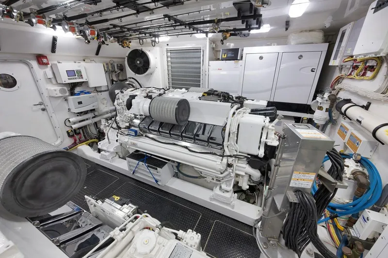 Slide: The Image of Engine room of 2018 Viking 92 Sky Bridge yacht, showcasing advanced machinery and equipment. - 132