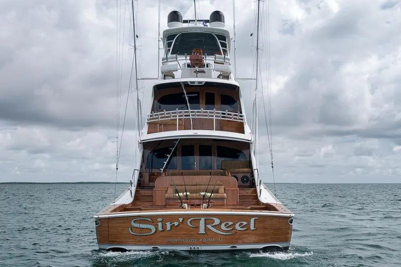 Slide: The Image of 2018 Viking 92 Sky Bridge yacht on open water under cloudy skies. - 21