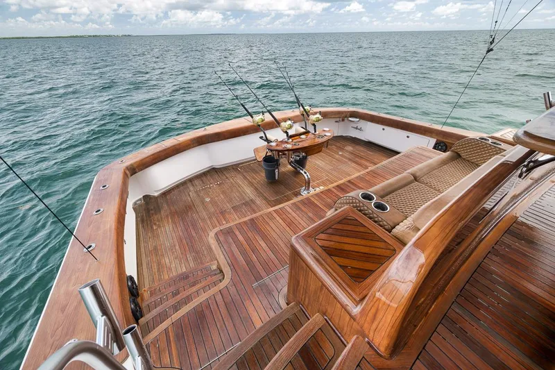 Slide: The Image of Luxurious 2018 Viking 92 Sky Bridge yacht deck with fishing rods and ocean view. - 33