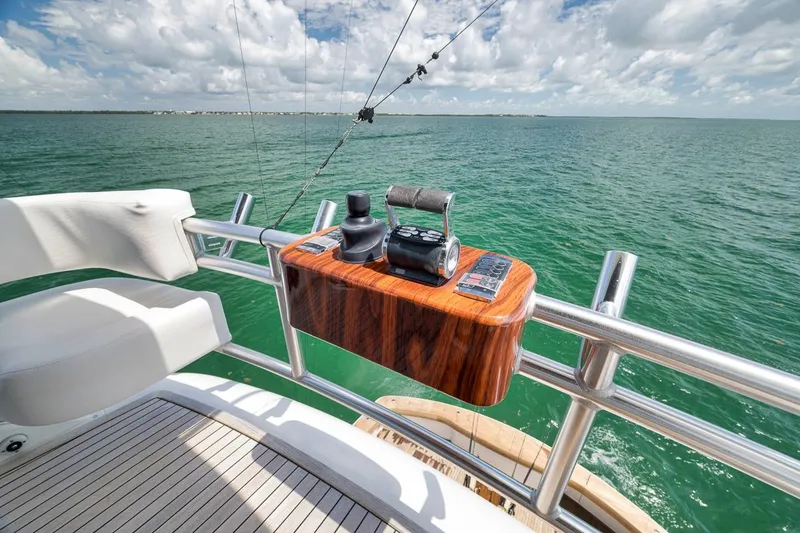 Slide: The Image of Control panel on 2018 Viking 92 Sky Bridge yacht overlooking ocean. - 56