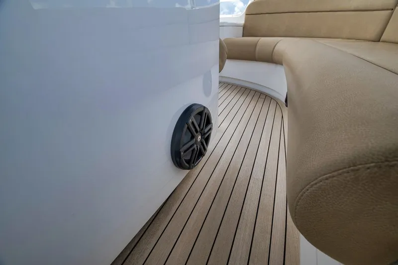 Slide: The Image of Luxurious seating and speaker on 2018 Viking 92 Sky Bridge yacht deck. - 68