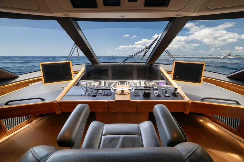 Slide: The Image of Luxurious helm of 2018 Viking 92 Sky Bridge yacht with panoramic ocean view. - 75