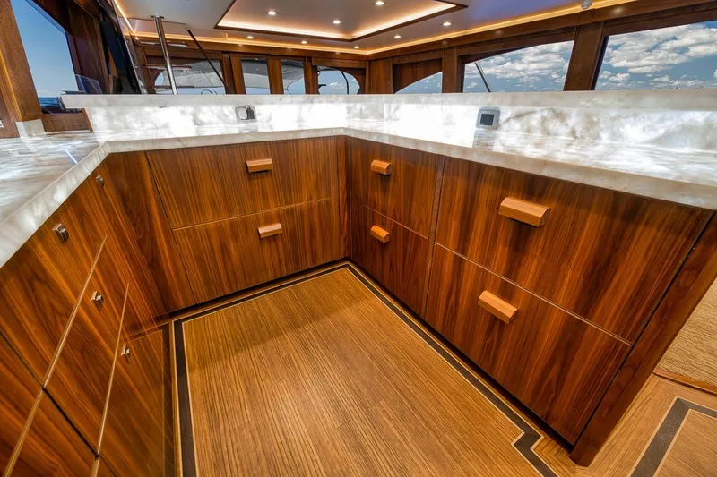 Slide: The Image of Luxurious wooden cabinetry in 2018 Viking 92 Sky Bridge yacht interior. - 90