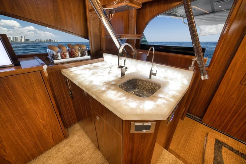Slide: The Image of Luxurious interior of 2018 Viking 92 Sky Bridge yacht with elegant wood finish and ocean view. - 96
