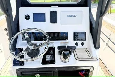 Slide: The Image of 2025 Yamaha Boats 222 FSH Sport E dashboard with steering wheel and control panel. - 14