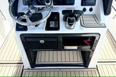 Slide: The Image of 2025 Yamaha Boats 222 FSH Sport E dashboard with steering wheel and controls. - 15
