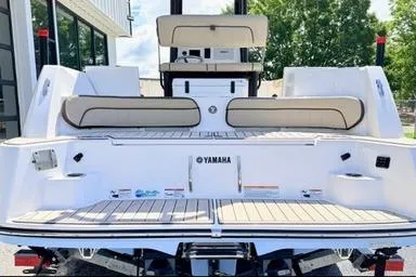 Slide: The Image of 2025 Yamaha Boats 222 FSH Sport E, rear view, showcasing spacious seating and sleek design. - 7