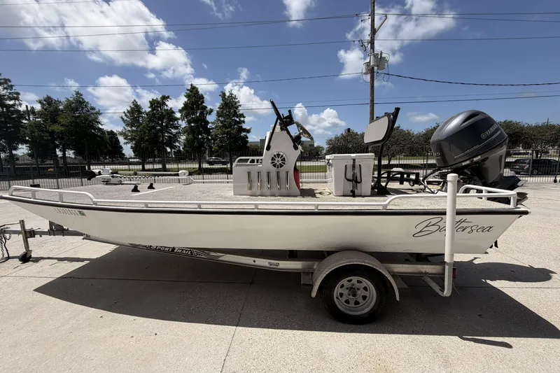 Slide: The Image of Custom 2017 Battersea boat on trailer with Yamaha engine, parked outdoors. - 5