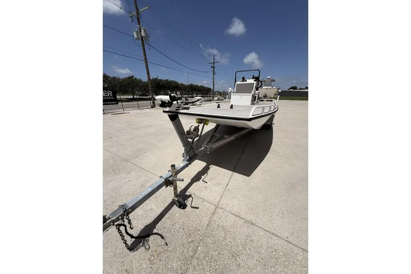 Slide: The Image of Custom 2017 Battersea boat on trailer under clear blue sky. - 8