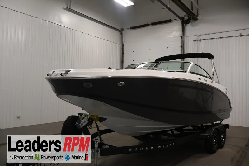 The Image of 2026 Four Winns HD3 boat on trailer in indoor showroom. - 0