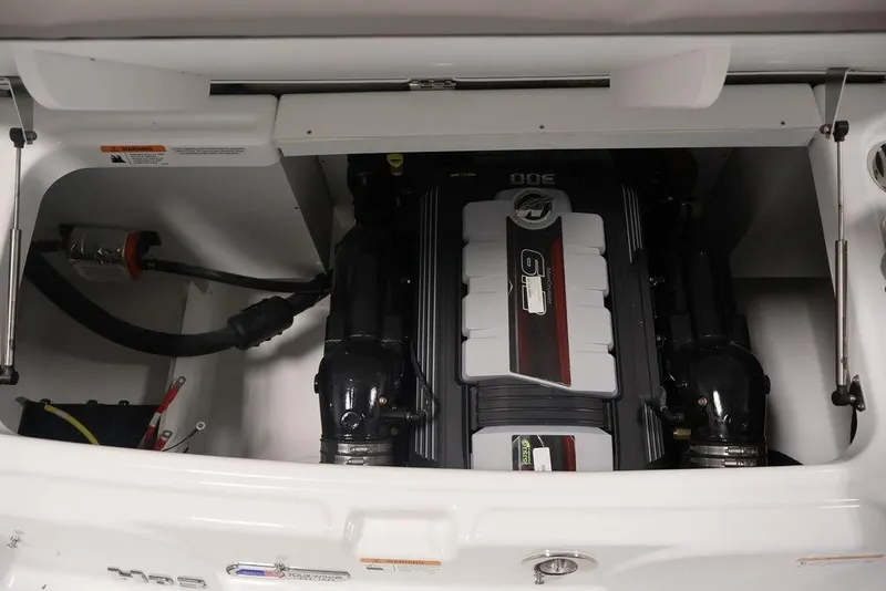 Slide: The Image of Engine compartment of 2026 Four Winns HD3 boat, featuring a powerful inboard motor. - 18