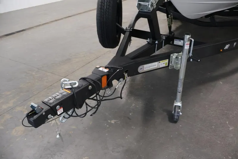 Slide: The Image of Trailer hitch of 2026 Four Winns HD3 boat, featuring sturdy construction and safety chains. - 19