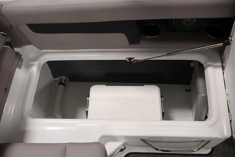 Slide: The Image of 2026 Four Winns HD3 boat storage compartment with cooler and seating area. - 28