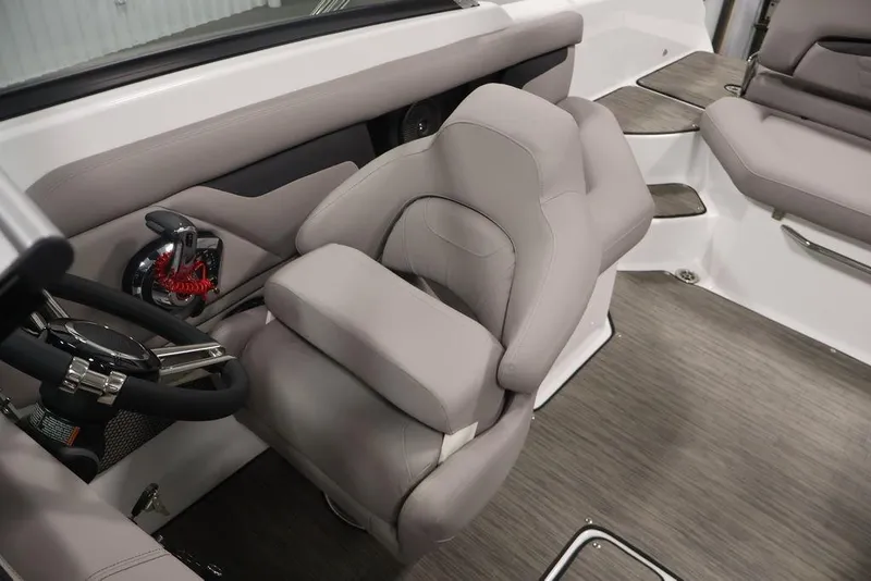 Slide: The Image of 2026 Four Winns HD3 boat interior with plush seating and modern steering wheel. - 32