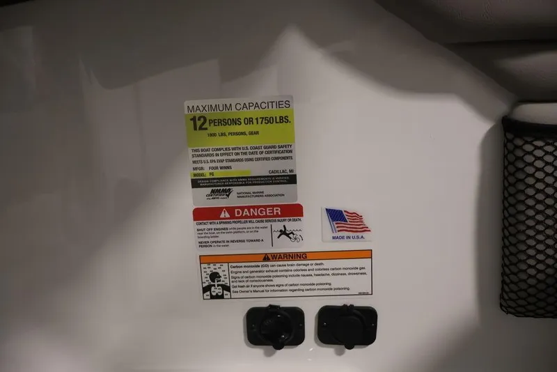 Slide: The Image of 2026 Four Winns HD3 boat capacity and safety labels, made in USA. - 38