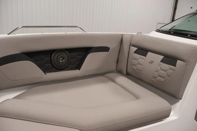 Slide: The Image of 2026 Four Winns HD3 boat interior with beige seating and integrated speaker. - 39