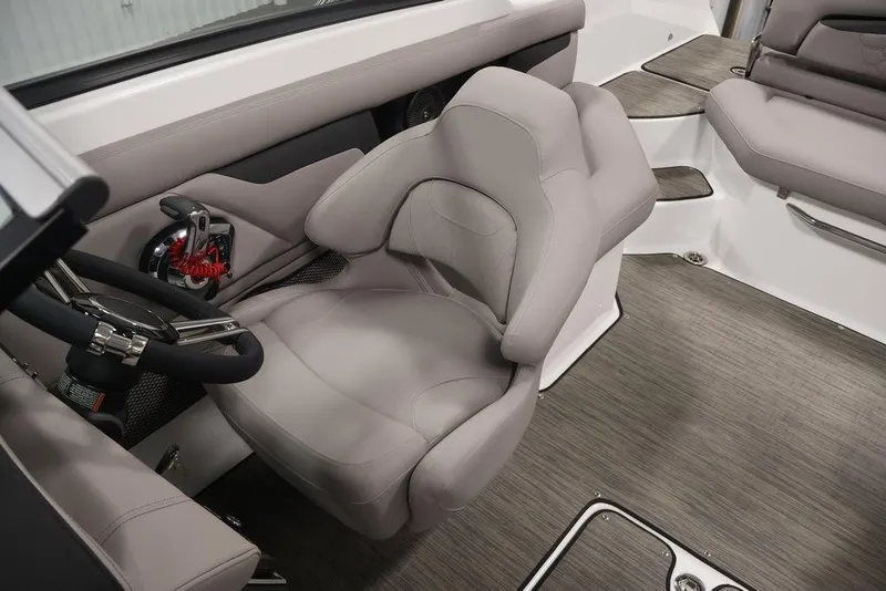 Slide: The Image of 2026 Four Winns HD3 boat interior with gray seating and modern steering wheel. - 43