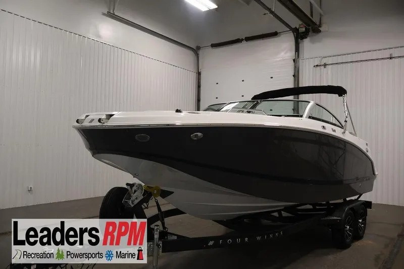 Slide: The Image of 2026 Four Winns HD3 boat on trailer in indoor showroom setting. - 45