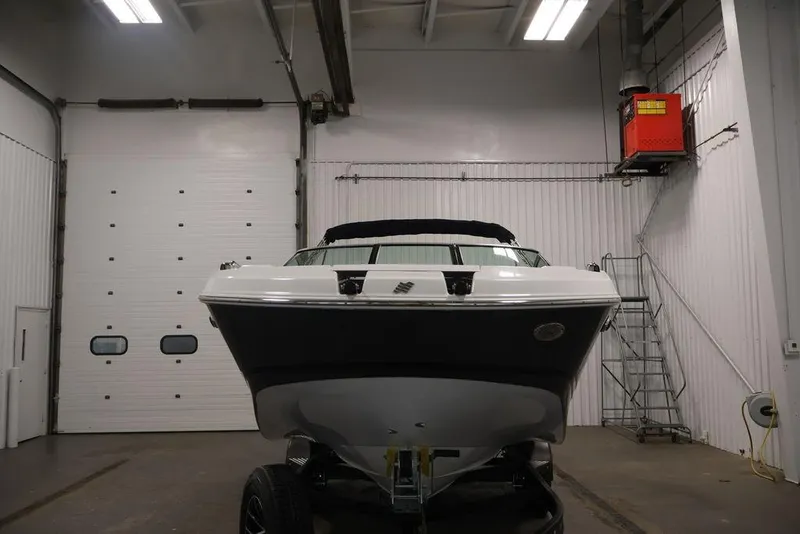 Slide: The Image of 2026 Four Winns HD3 boat in indoor storage facility, front view. - 50