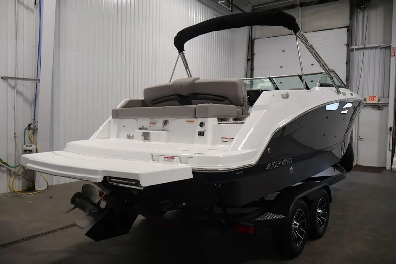 Slide: The Image of 2026 Four Winns HD3 boat in a garage, showcasing sleek design and modern features. - 6