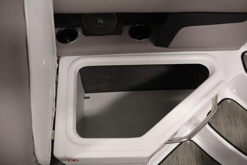 Slide: The Image of Storage compartment in 2026 Four Winns HD3 boat, featuring sleek design and integrated cup holders. - 7