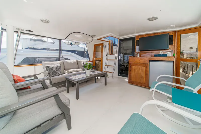 Slide: The Image of Spacious cockpit of 1991 Californian 55 Cockpit Motor Yacht with comfortable seating and modern amenities. - 16