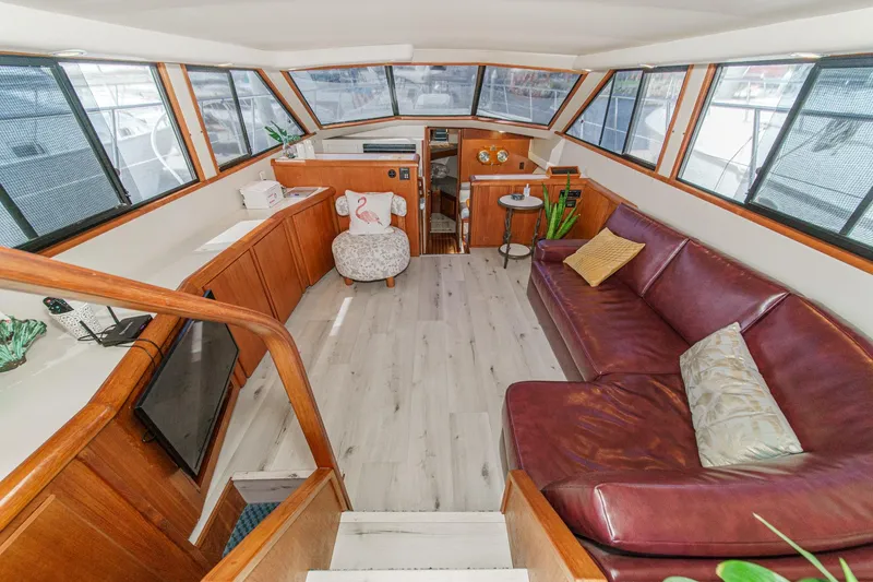 Slide: The Image of Luxurious interior of 1991 Californian 55 Cockpit Motor Yacht with leather seating and panoramic windows. - 19