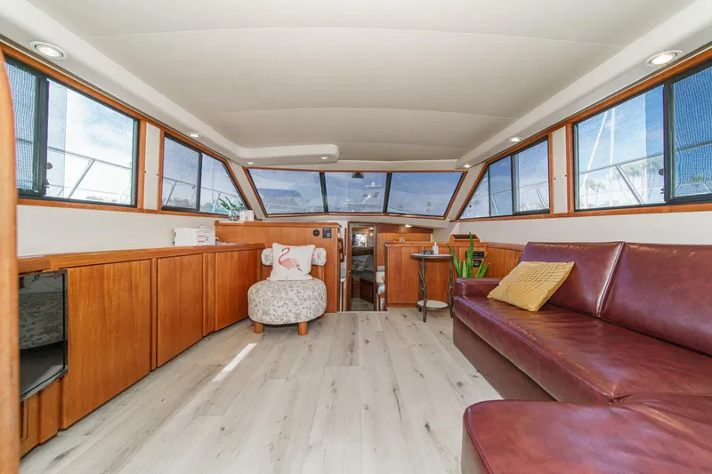 Slide: The Image of Luxurious interior of 1991 Californian 55 Cockpit Motor Yacht with elegant seating and wood finishes. - 22