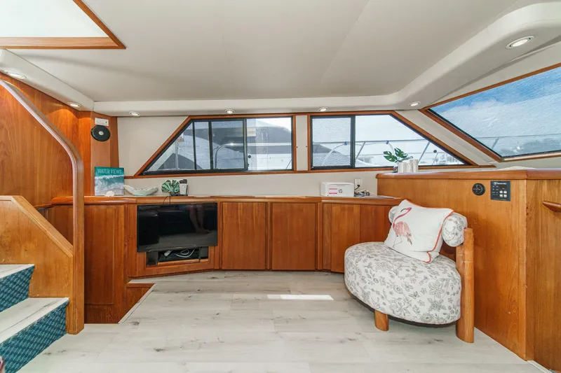 Slide: The Image of Luxurious interior of 1991 Californian 55 Cockpit Motor Yacht with elegant wood finishes. - 23