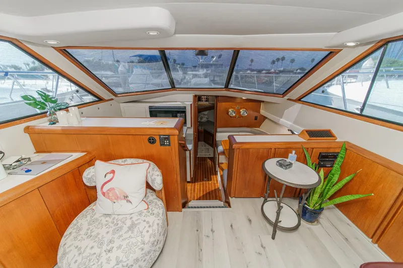 Slide: The Image of Luxurious interior of a 1991 Californian 55 Cockpit Motor Yacht with elegant wood finishes. - 24