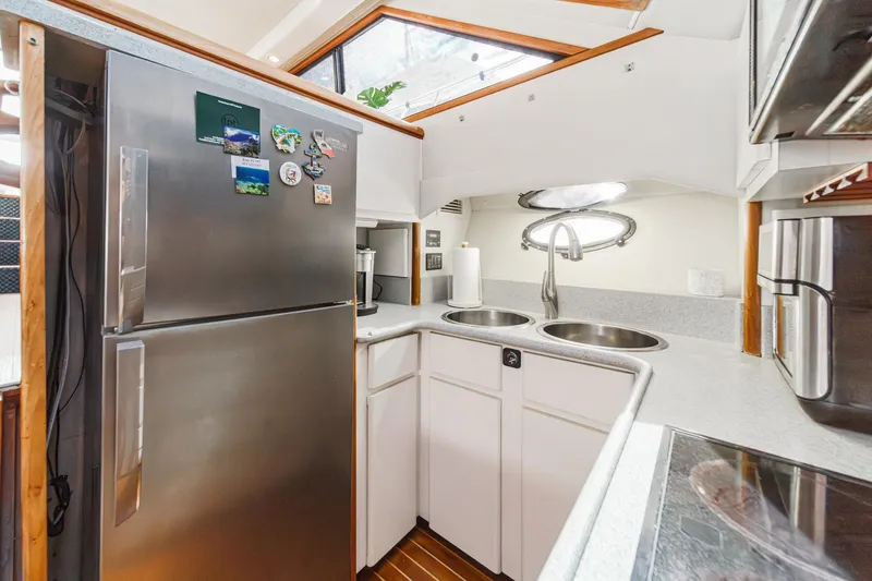 Slide: The Image of Modern kitchen in 1991 Californian 55 Cockpit Motor Yacht with stainless steel appliances. - 28
