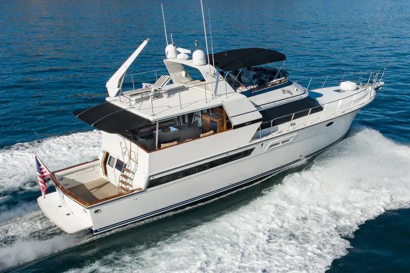 Slide: The Image of 1991 Californian 55 Cockpit Motor Yacht cruising on open water. - 3
