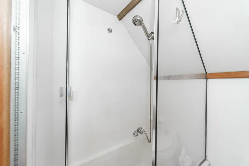 Slide: The Image of Shower area in 1991 Californian 55 Cockpit Motor Yacht, featuring glass doors and modern fixtures. - 42